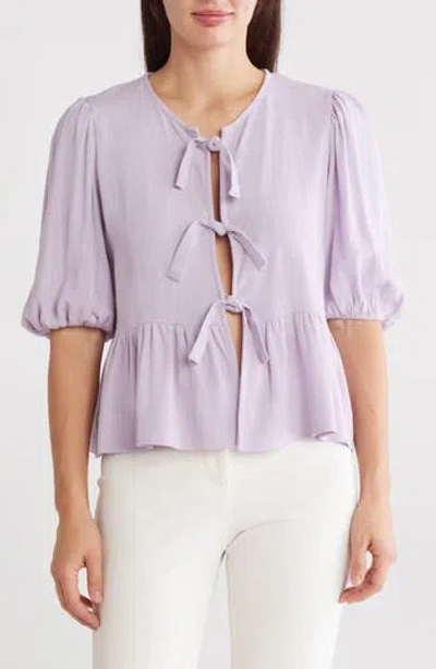 Renee C Tie Front Peplum Top In Lavender