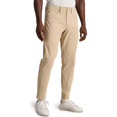 Rhone Commuter Pro Joggers In Brown