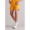 Rhone Extra Mile Running Shorts In Autumn Gold