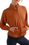 Rhone Mirage Water-repellent Half-zip Jacket In Orange