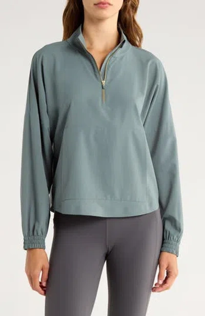 Rhone Mirage Water-repellent Half-zip Jacket In Blue
