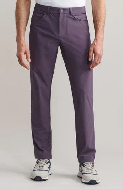 Rhone Momentum Water Repellent Flat Front Golf Pants In Purple
