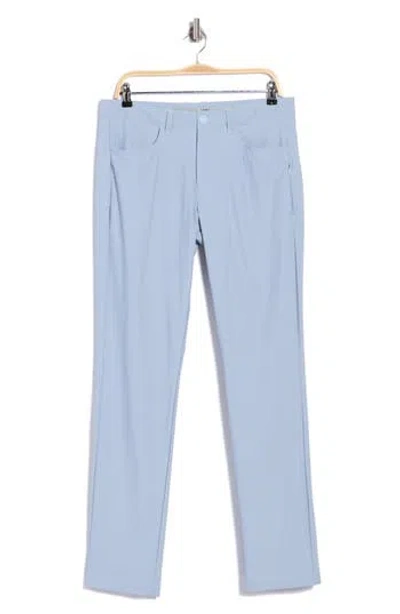 Rhone Momentum Water Repellent Flat Front Golf Pants In Blue