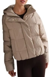 Rhone Powder 650 Fill Power Down Puffer Jacket In Brown