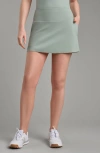 Rhone Course To Course Skort In Pacific Green