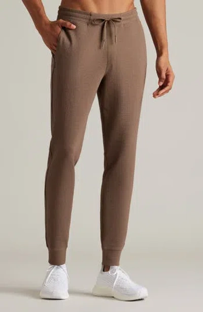 Rhone Tribeca Tech Joggers In Brown
