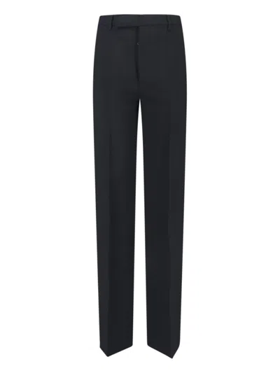 RICK OWENS HIGH-WAISTED PLEATED TROUSERS - BLACK