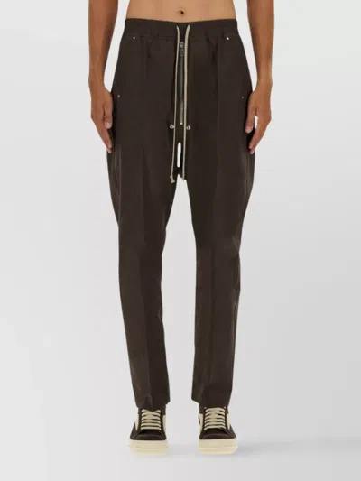 RICK OWENS TROUSERS WITH TAPERED LEG AND POCKETS