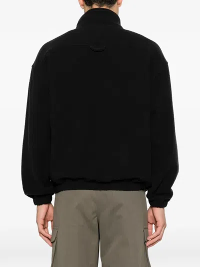 Rier Zipped-pocket High-neck Sweater In Black