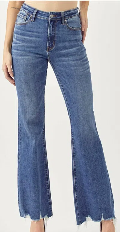 Risen Mid Rise Raw Hem Jeans In Medium Wash