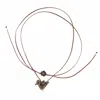 River Song Carved Stone Bird Necklace In Brown In Gold