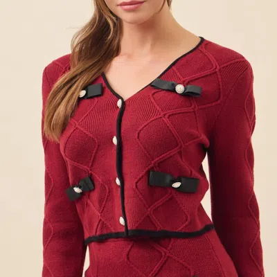 Rivir Cable Knit Cardigan With Contrast Bows And Pearl Flowered Buttons In Burgundy