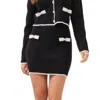 Rivir Cable Knit Mini Skirt With Contrast Bows And Pearl Flowered Buttons In Black