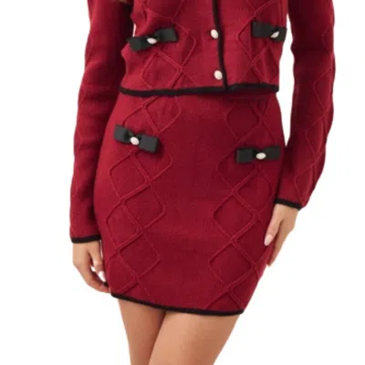 Rivir Cable Knit Mini Skirt With Contrast Bows And Pearl Flowered Buttons In Burgundy