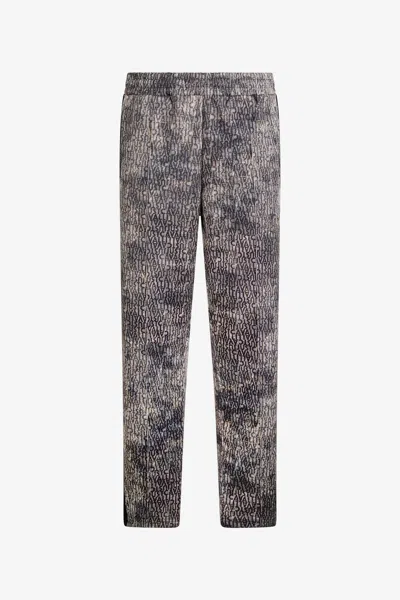 Roberto Cavalli Faded Effect Trousers With All-over Lettering In Gray