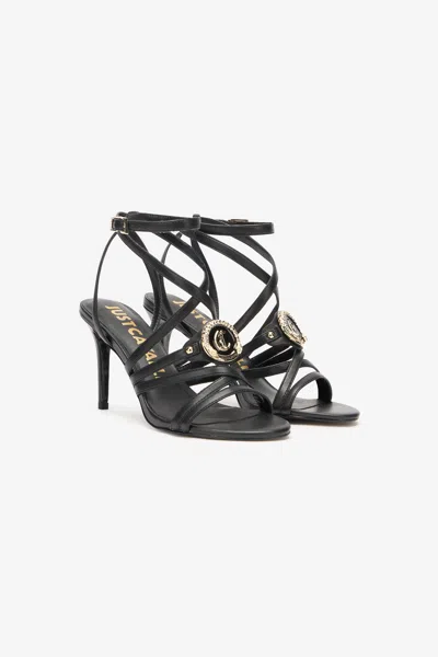 Roberto Cavalli Sandals With Logo Medallion In Black