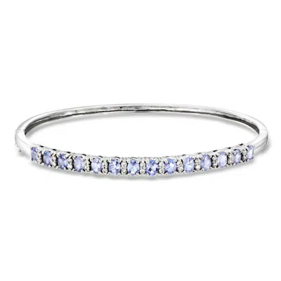 Pre-owned Ross-simons C. 1990 Vintage 2.25 Ct. T.w. Tanzanite Bangle Bracelet With .45 Ct. T.w. Diamonds In 14kt White Gol In Silver