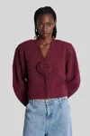Rotate Birger Christensen Rotate Cropped Burgundy Sweater With Deep V-neckline And Floral Embellishment In Burgundy