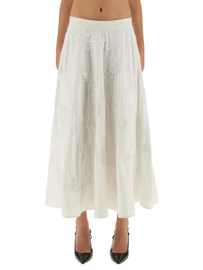 ROTATE BIRGER CHRISTENSEN FLORAL EMBROIDERED A-LINE MIDI SKIRT IN ORGANIC COTTON