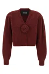 Rotate Birger Christensen Rotate Cropped Burgundy Sweater With Deep V-neckline And Floral Embellishment In Burgundy