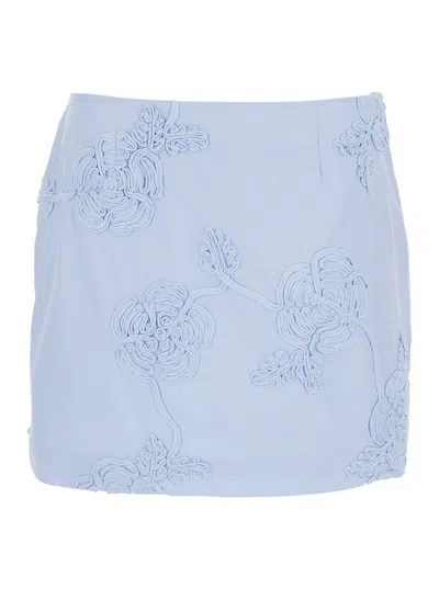 ROTATE BIRGER CHRISTENSEN LIGHT BLUE MINI SKIRT WITH LOW WAIST AND ALL-OVER FLORAL MOTIF