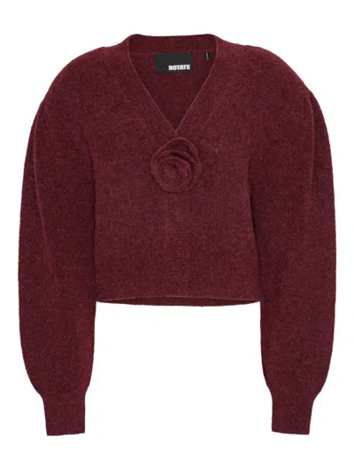 ROTATE BIRGER CHRISTENSEN ROTATE CROPPED BURGUNDY SWEATER WITH DEEP V-NECKLINE AND FLORAL EMBELLISHMENT