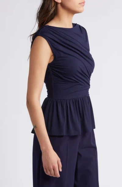 Rue Sophie Leona Asymmetric Back Peplum Top In Blue