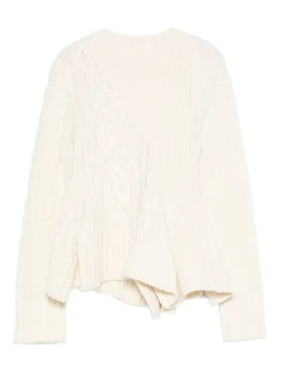 SACAI CABLE KNIT SWEATER WITH RUFFLED HEM AND ASYMMETRICAL DETAILS