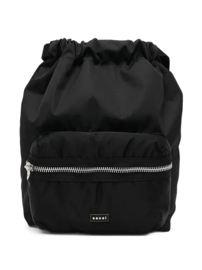Sacai Drawstring Zip-pocket Backpack In Brown