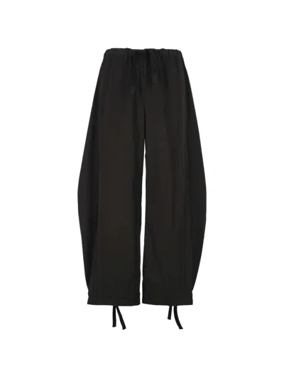 Sacai Drawstring-cuff Trousers In Black