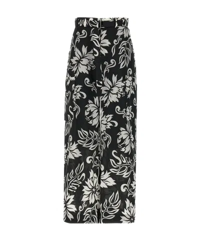 SACAI SACAI ALL-OVER PRINTED BELTED TROUSERS