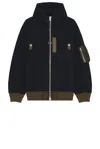 Sacai Hooded Knitwear With Ribbed Hem In Black