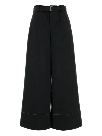 Sacai Welt-pockets Cuffed Trousers In Black