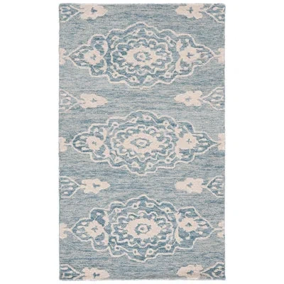 Safavieh Ebony Hand Tufted Wool/cotton Southwestern Rug In Ivory/light Blue In Ivory,light Blue;ivory,light Blue