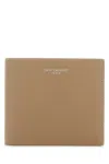 Saint Laurent Textured Leather Bi-fold Wallet In Brown