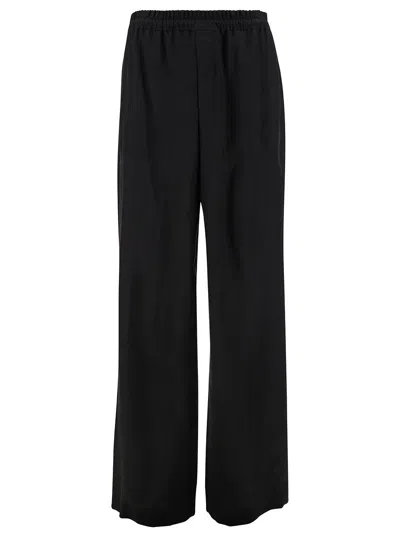 SAINT LAURENT BLACK JOGGER PANTS WITH ELASTIC WAISTBAND IN CUPRO MAN