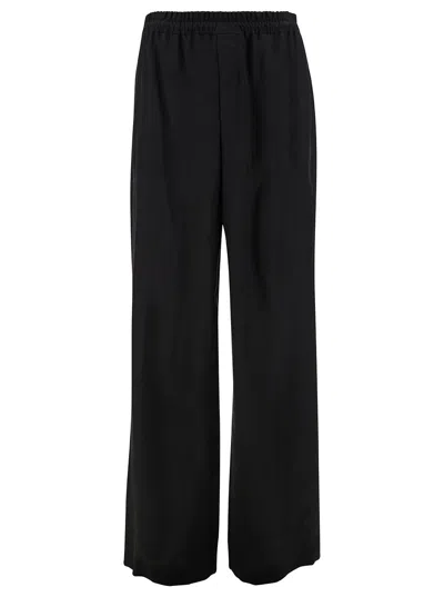 Saint Laurent Black Jogger Trousers With Elastic Waistband In Cupro Man