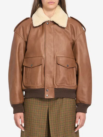 SAINT LAURENT BOMBER JACKET IN HAMMERED LEATHER AND SHEARLING