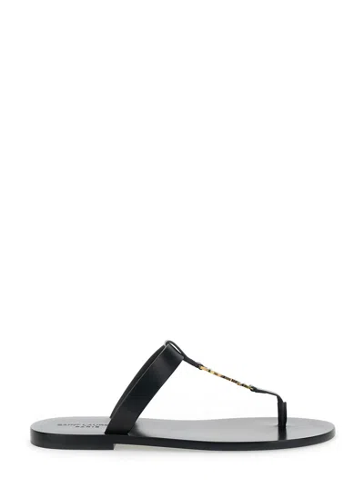 SAINT LAURENT SAINT LAURENT 'CASSANDRE' BLACK FLAT SANDALS WITH A T-STRAP IN LEATHER WOMAN