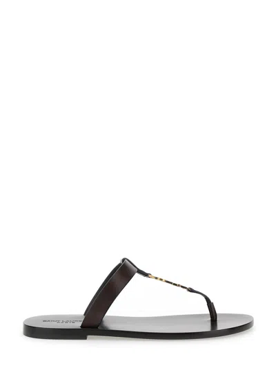 SAINT LAURENT SAINT LAURENT 'CASSANDRE' BROWN FLAT SANDALS WITH A T-STRAP IN LEATHER WOMAN