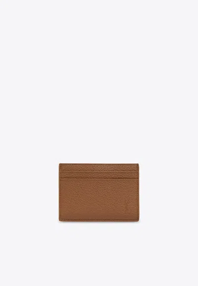 Saint Laurent Debossed-logo Leather Cardholder In Brown