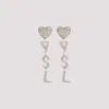 Saint Laurent Heart Ysl Clip Earrings In Argent Oxyde Crystal