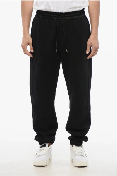 Saint Laurent Cuffed Fleeced Cotton Sweatpants With Nylon Detail In Black