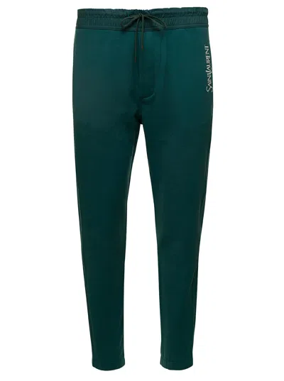 SAINT LAURENT GREEN JOGGING PANTS WITH DRAWSTRING AND LOGO EMBROIDERY IN COTTON MAN