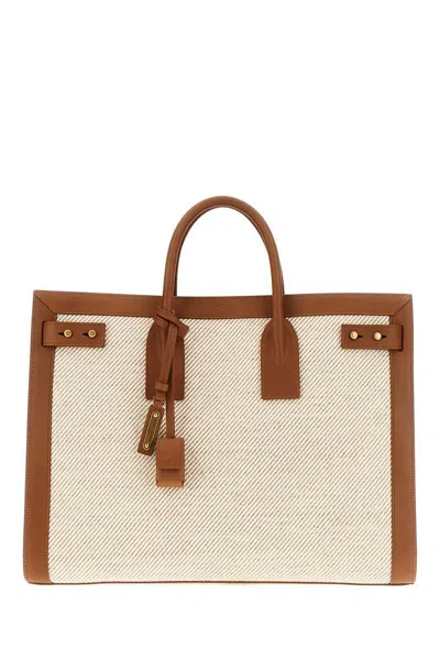 Saint Laurent Handbags. In Brown