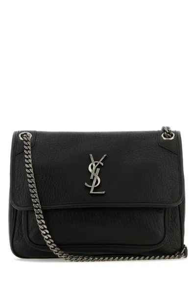 Saint Laurent Handbags. In Black