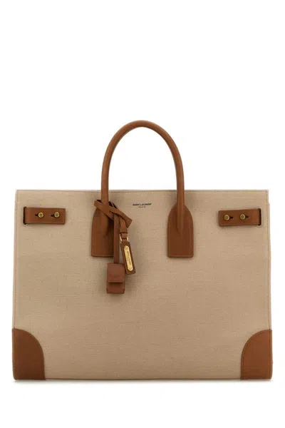 Saint Laurent Handbags. In Brown