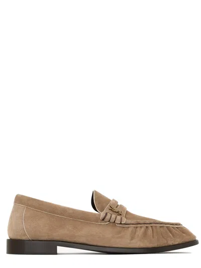 Saint Laurent Hand-stitched Moc Toe Leather Flats With Gold-tone Cassandre Hardware In Beige