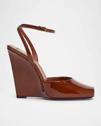 SAINT LAURENT LA SCANDALE GLOSSY ANKLE-STRAP WEDGE SANDALS