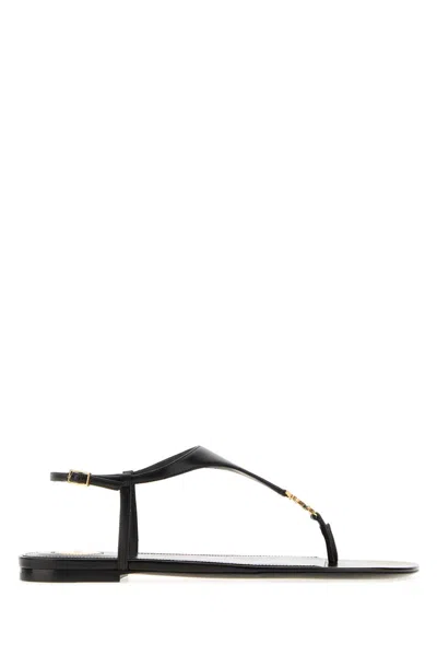 SAINT LAURENT SAINT LAURENT LEATHER THONG SANDALS WITH CASSANDRE DETAIL